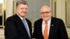 UKRAINE -- Ukrainian President Petro Poroshenko, left, poses with former New York Mayor Rudy Giuliani during their meeting in Kyiv, November 22, 2017