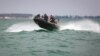 Ukraine -- Soldiers of the Special Action Unit on the Water of the Odessa Sea Guard detachment. The naval border guards worked out a non-parachute landing with a helicopter in the open sea. Odesa, 05Jul2019