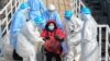 CHINA -- Medical staff transfer patients to the newly completed Huoshenshan temporary field Hospital in Wuhan, Hubei Province, February 4, 2020